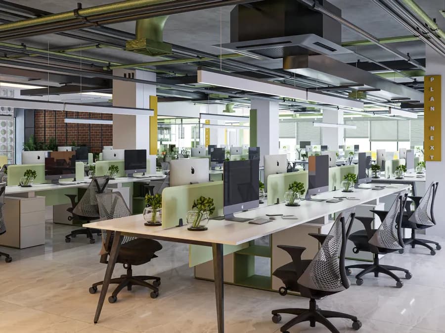 Corporate office green-themed workstation zone with organized desk layout